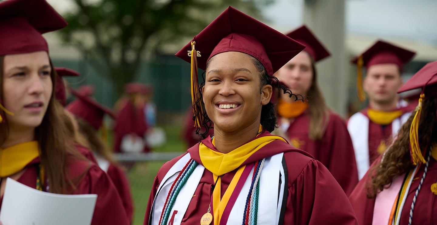 Student smiling at graduation
